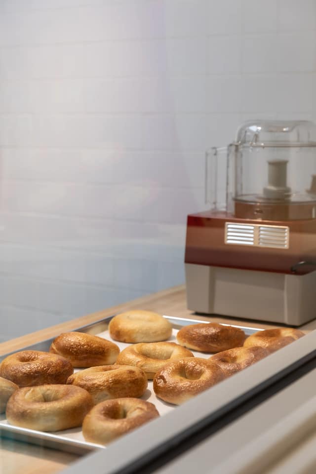 Display case stacked with hand-rolled bagels