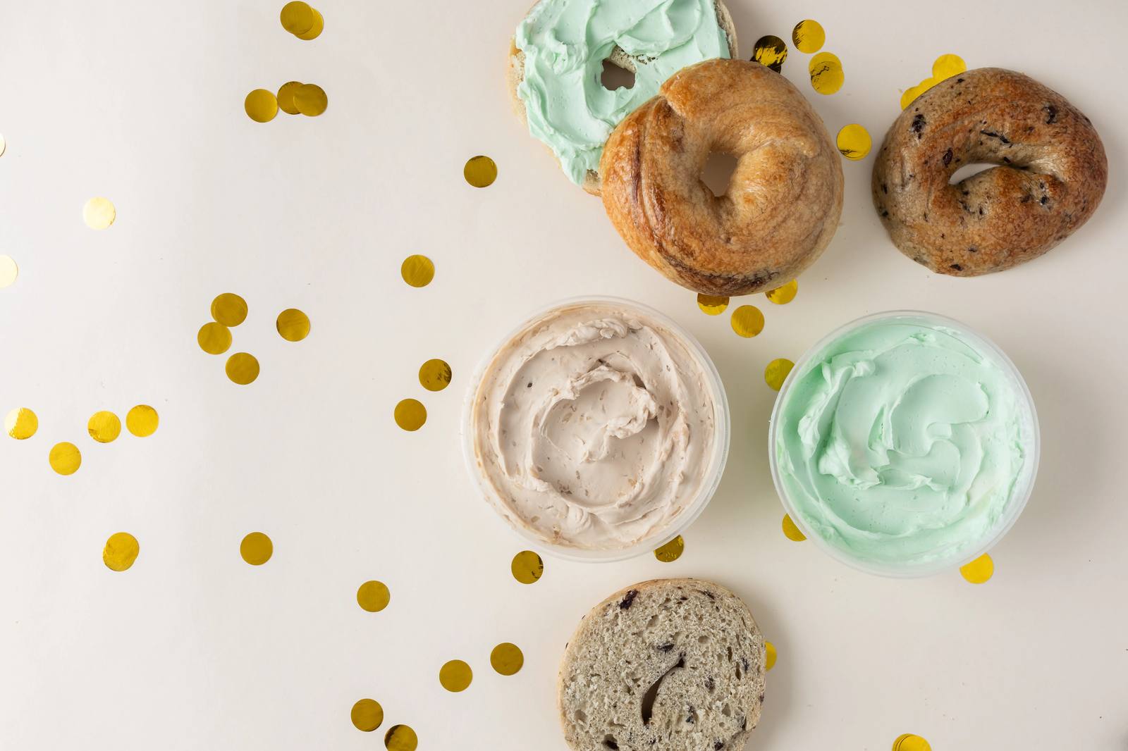 Colorful Ugly Bagel cream cheese and bagel flatlay
