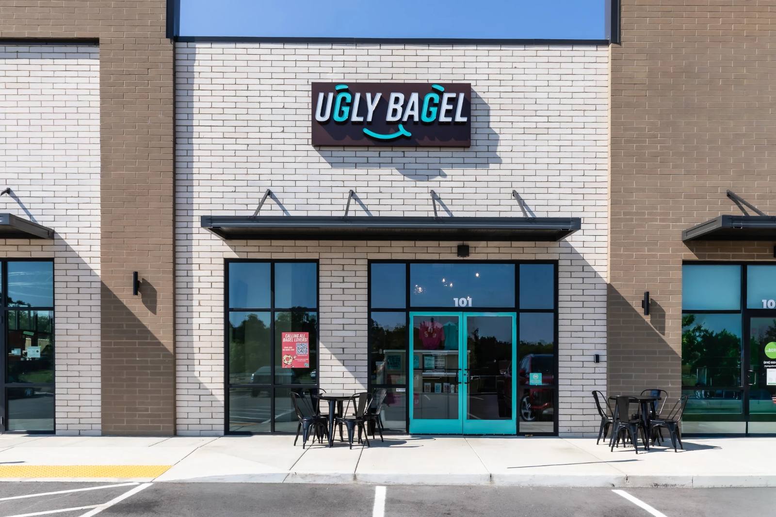 Ugly Bagel Mount Juliet storefront with Aqua doors and outdoor seating
