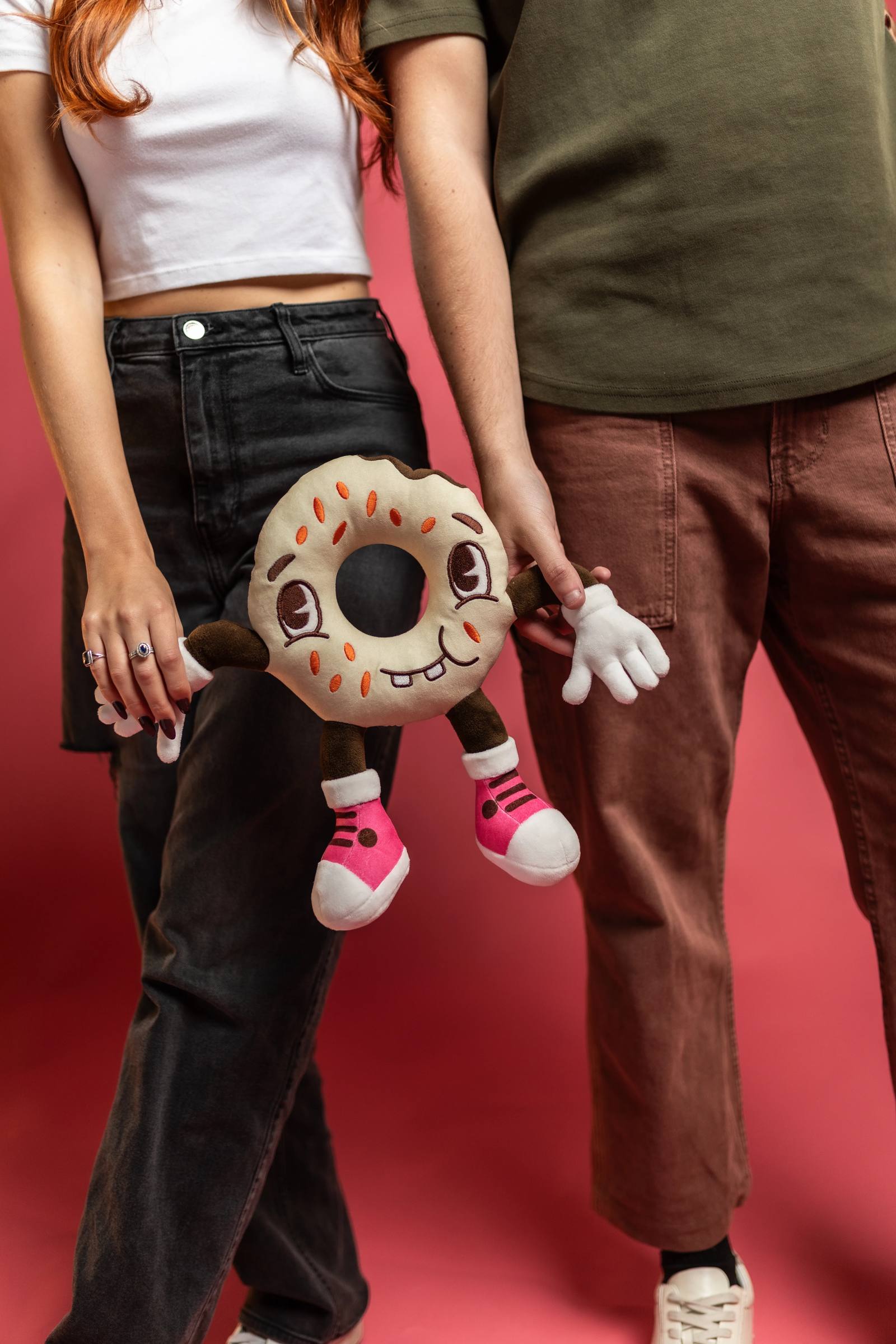 Guests holding Ugly Bagel plush toys