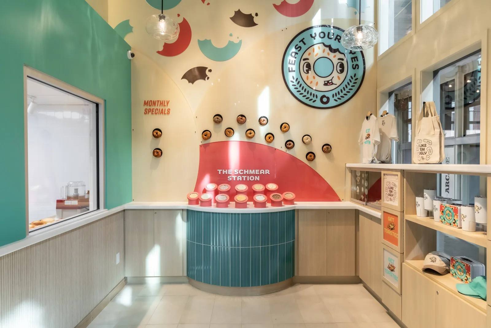 Retail counter and service window inside an Ugly Bagel shop