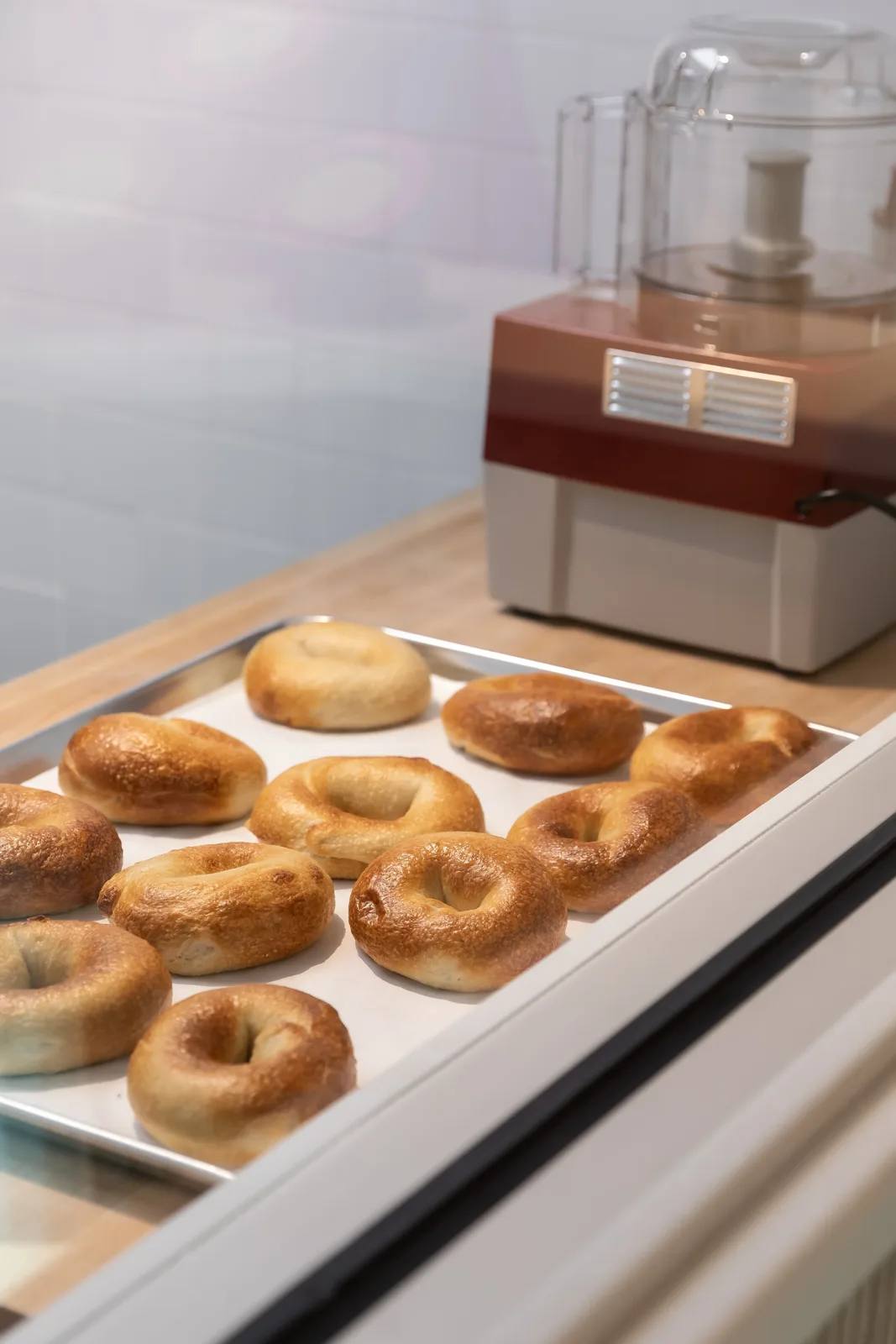 Bagel display case inside an Ugly Bagel shop